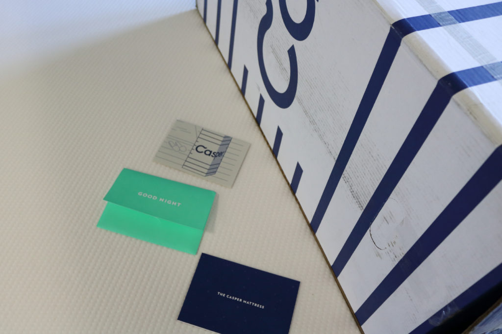 The Casper mattress, the box it came in, and the in-box materials