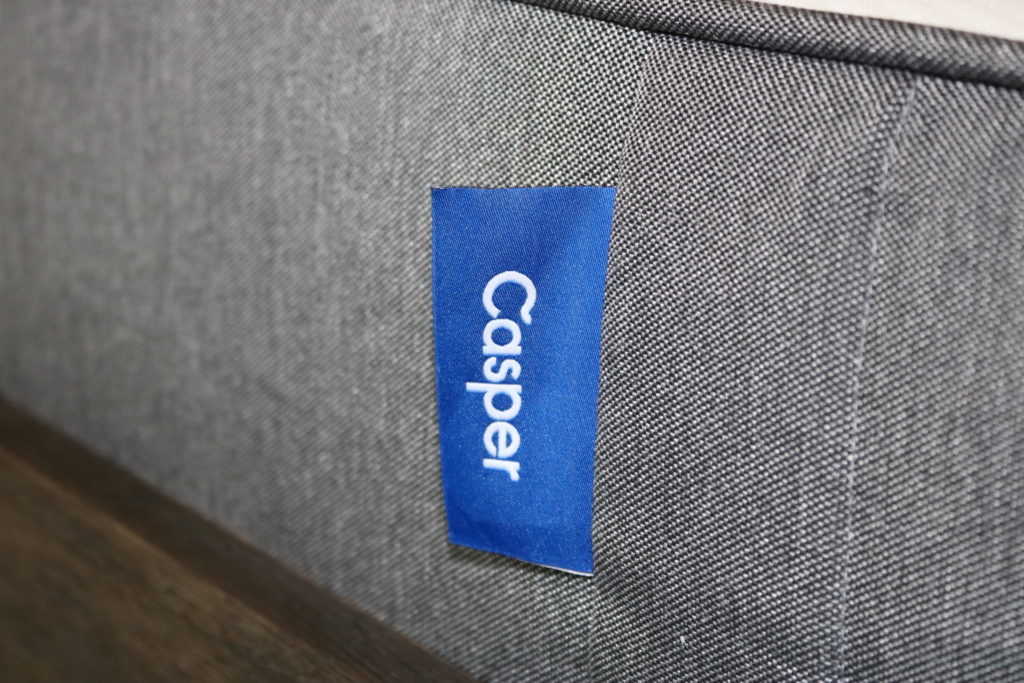A close-up of the Casper logo on the side of the Casper mattress