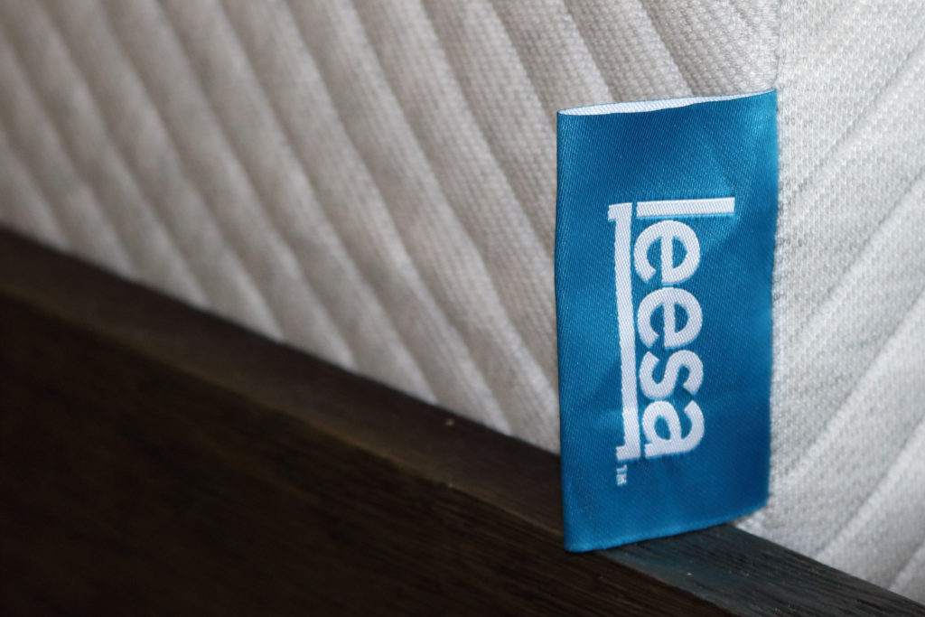 The Leesa logo stitched into the mattress