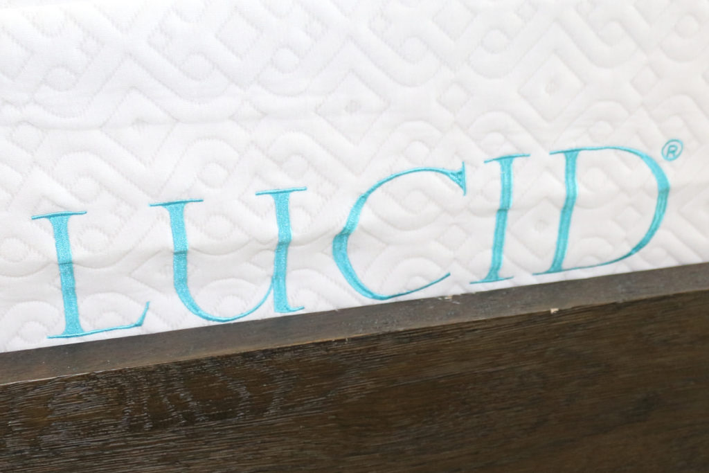 The Lucid mattress logo stitched in to the bed