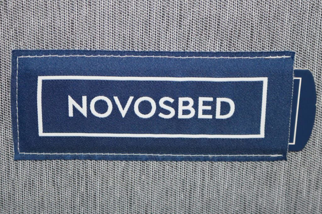 A close up of the Novosbed logo at the foot of the bed