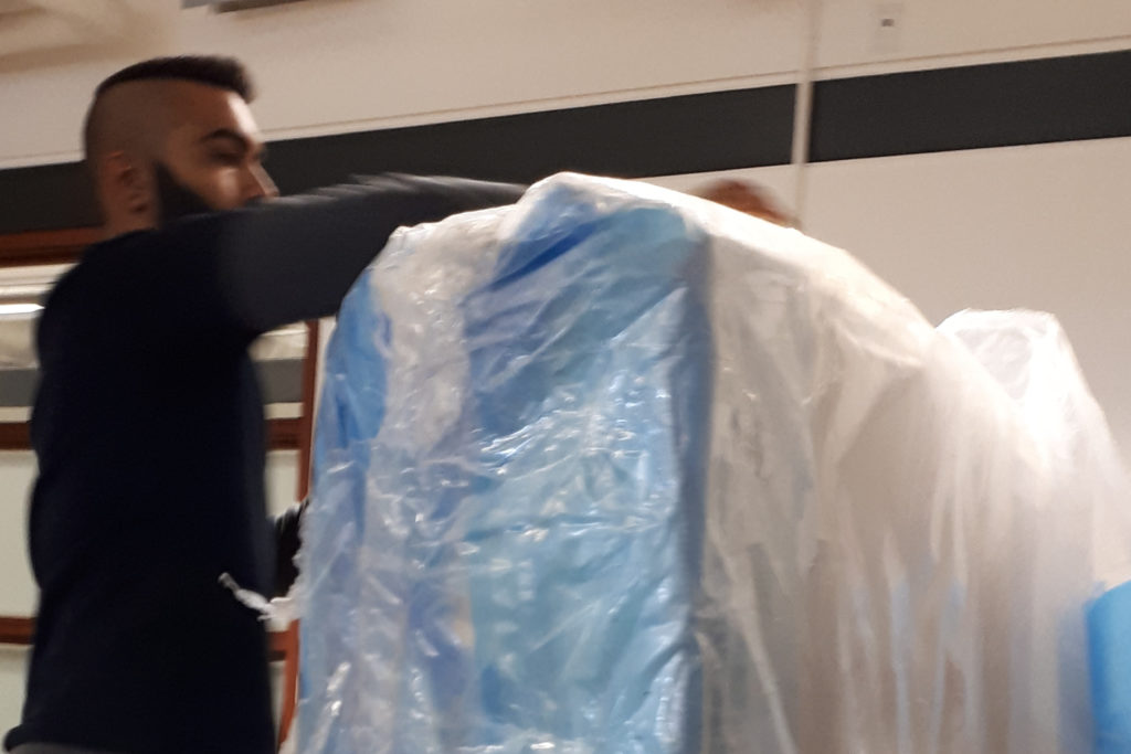 A local courier company delivering our Saatva mattress