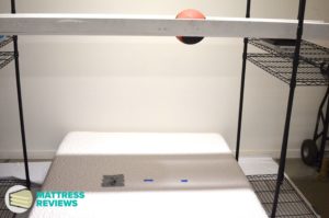 Image of the Novosbed Medium mattress motion isolation being testing by Mattress-Reviews.com the best source of professional, unbiased information for mattresses online.