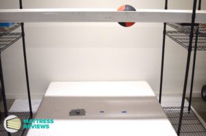 Image of the Novosbed Firm mattress motion isolation being testing by Mattress-Reviews.com the best source of professional, unbiased information for mattresses online.