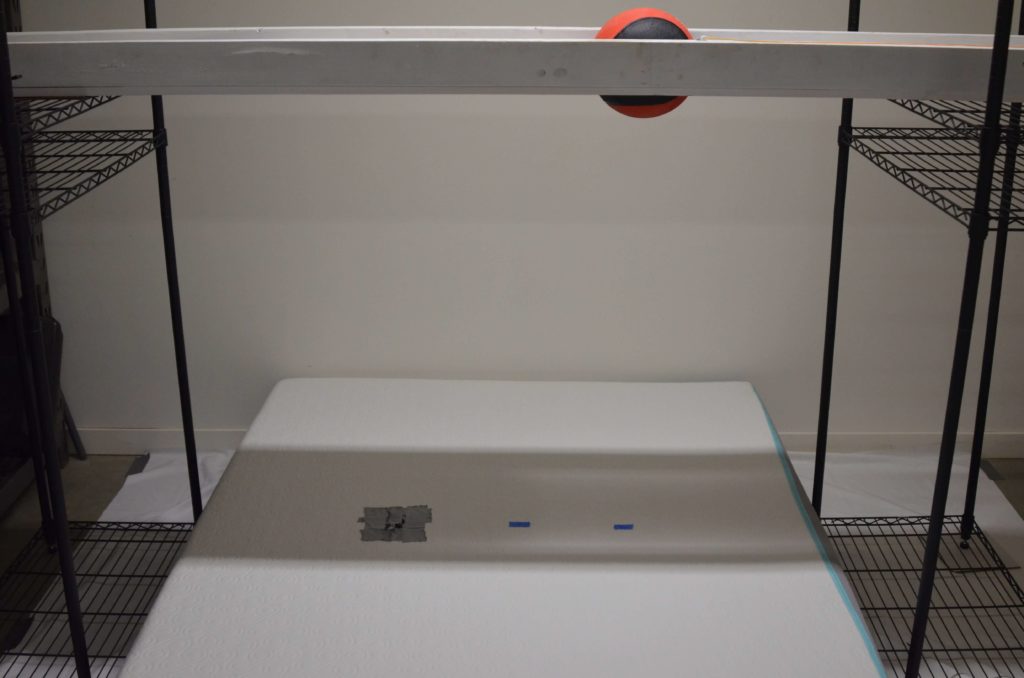 Image of the Bloom mattress motion isolation test.