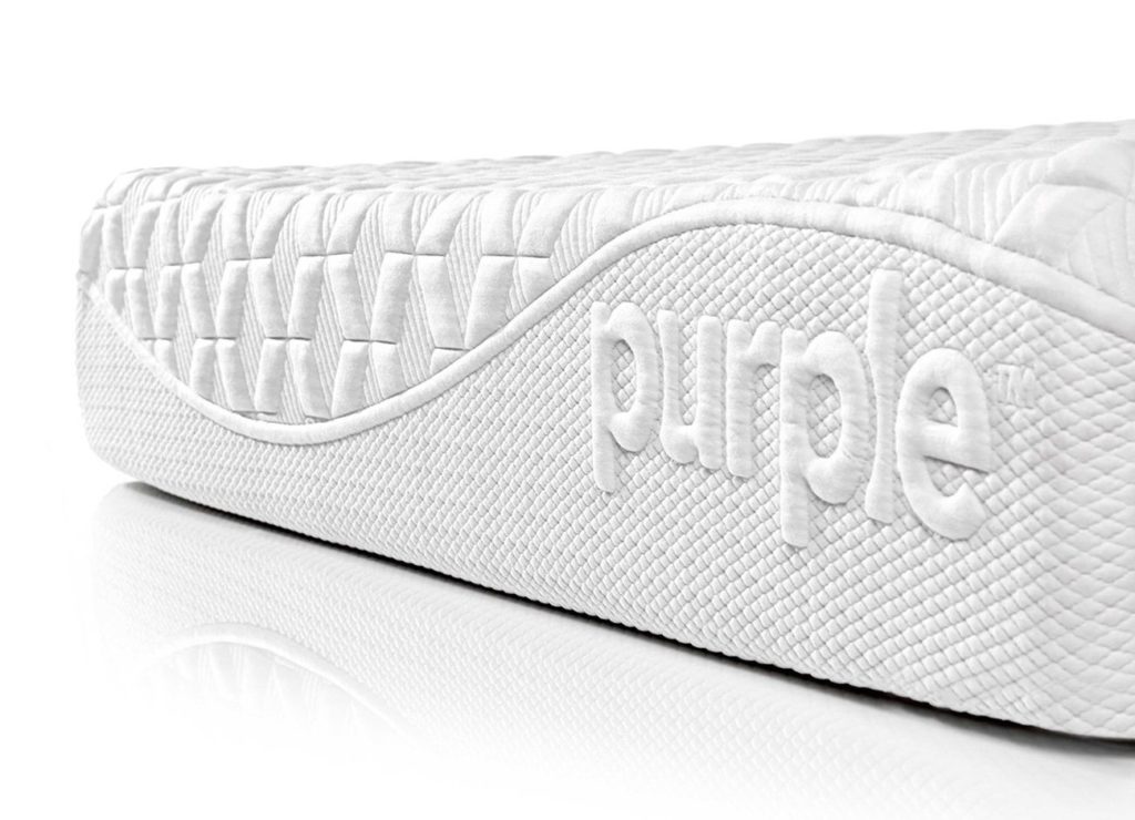 Image of the Purple logo on the front cover of the Purple mattress.