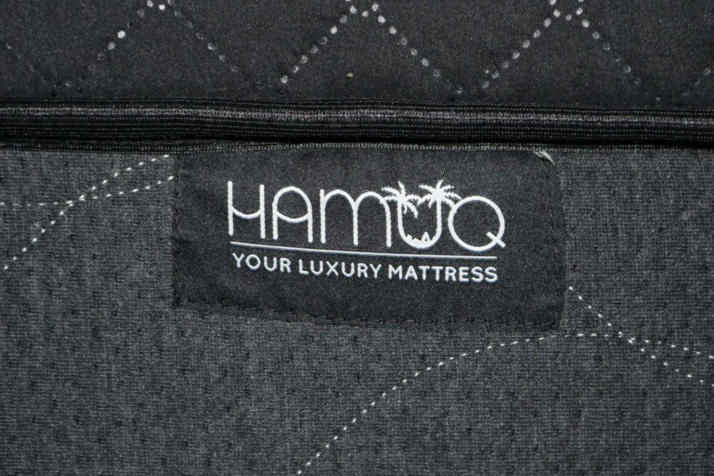 Image of the Hamuq logo on the front cover of the Hamuq mattress.