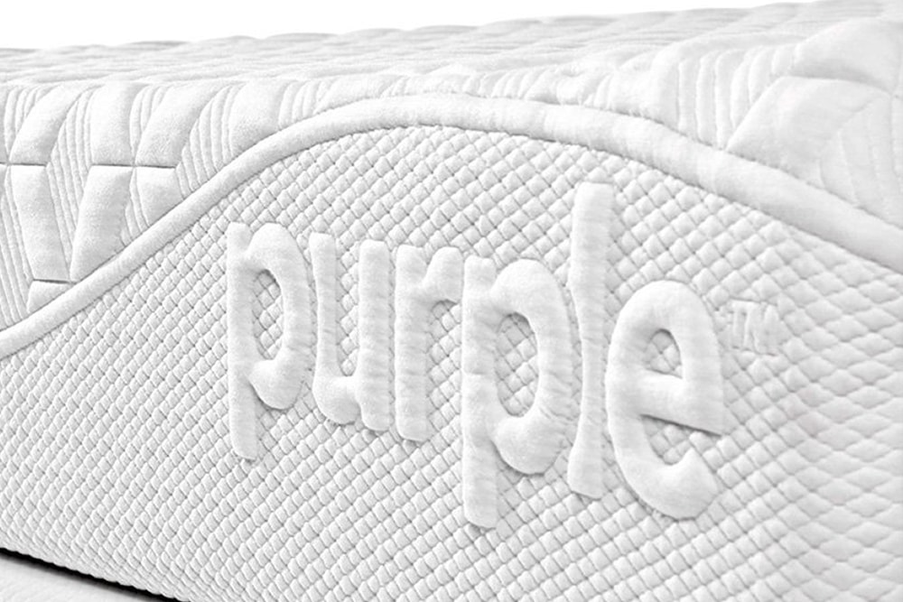 Image of the Purple logo on the front cover of the Purple mattress.