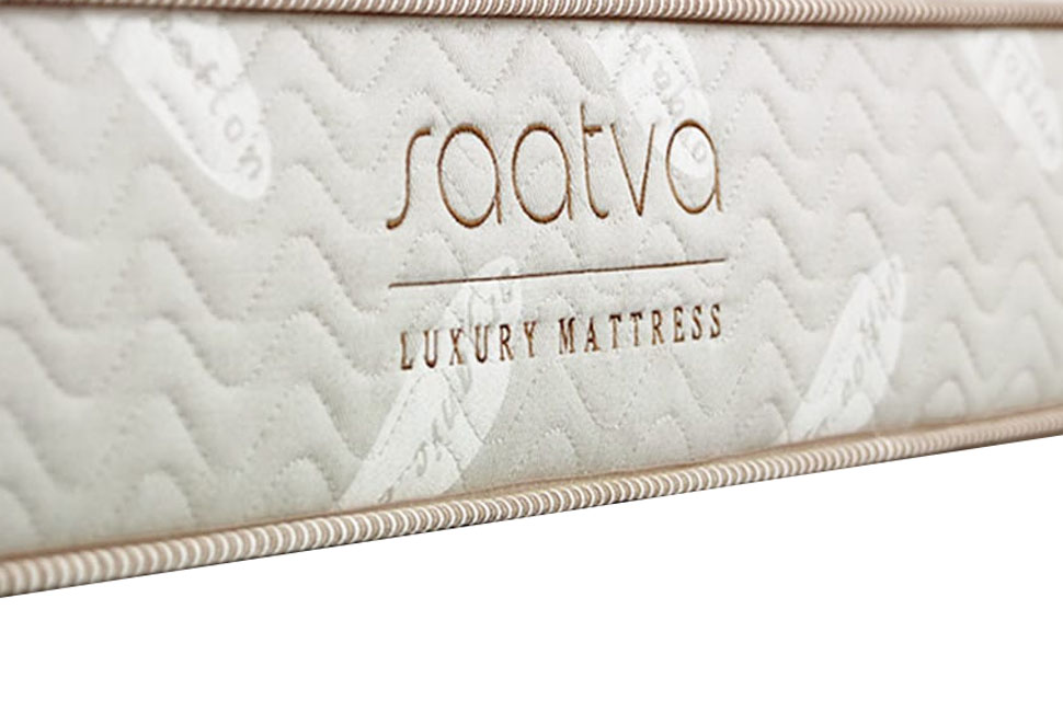 Image of the Saatva logo on the front cover of the Saatva mattress.