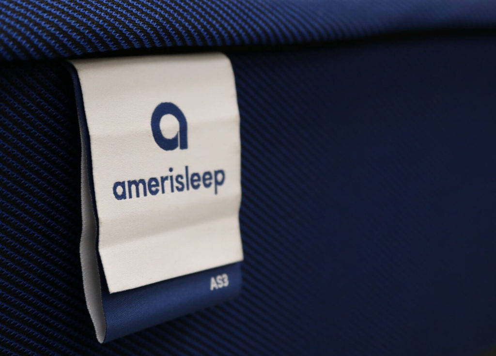 Image of the Amerisleep mattress tag on the front cover.