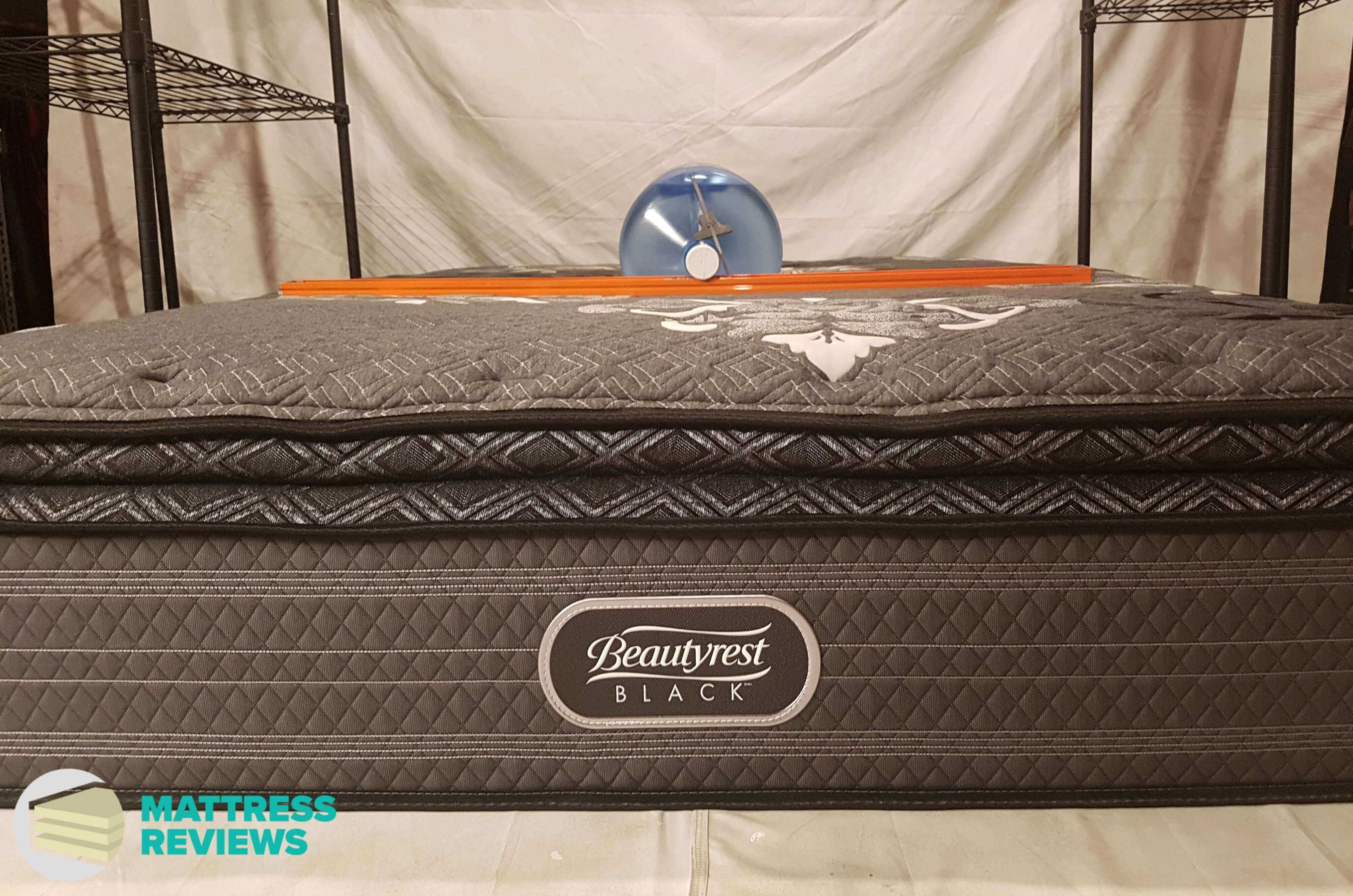 Image of the Beautyrest Black mattress firmness test.
