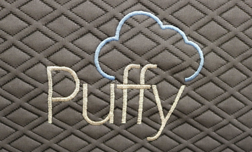 Image of the Puffy logo on the front cover of the Puffy mattress.