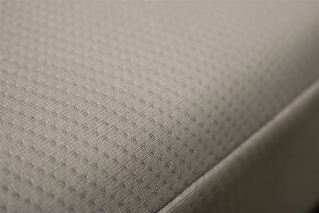 Close up image of the Bloom Earth mattress cover fabric.