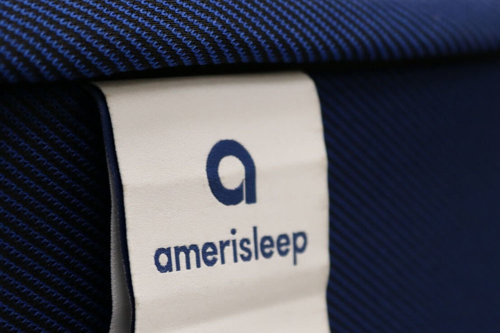 Image of the Amerisleep mattress tag on the front cover.