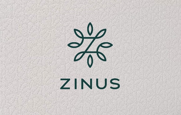 Image of the Zinus mattress tag on the front cover.