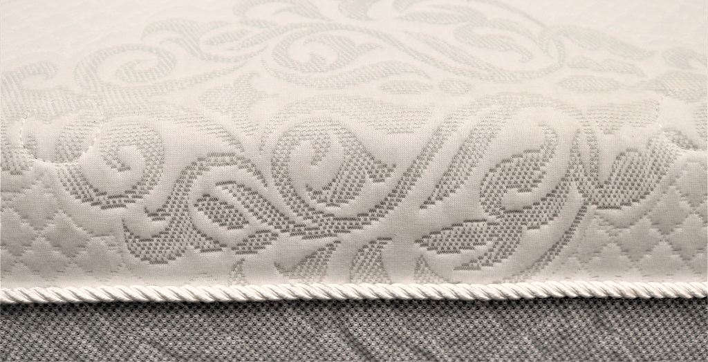 Image of the side wall and fabric piping details of the Novaform Costco mattress.