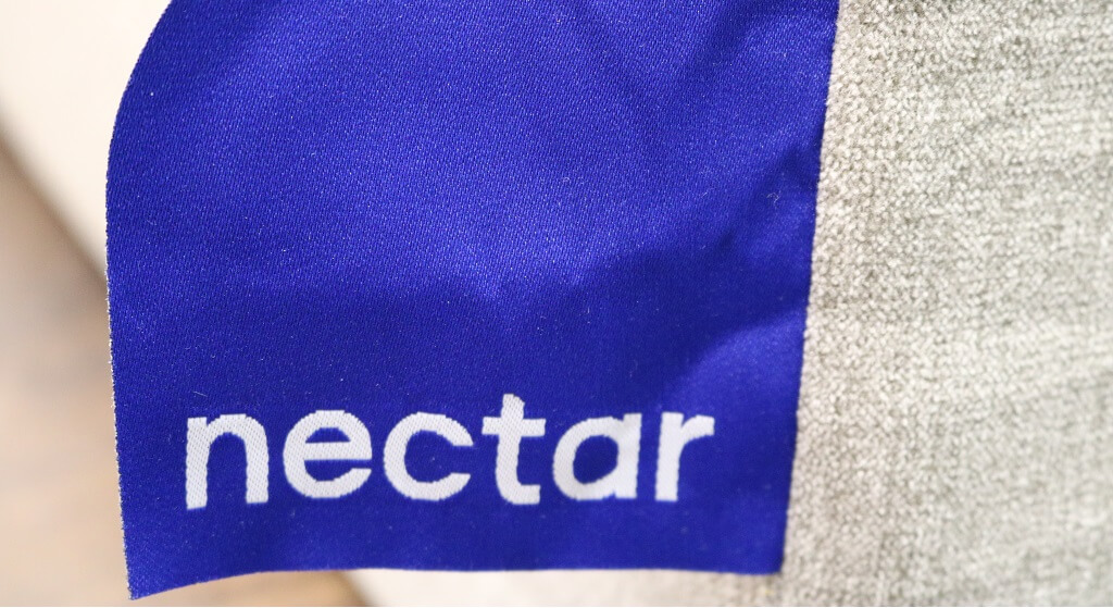 Image of the Nectar mattress company blue logo tag.