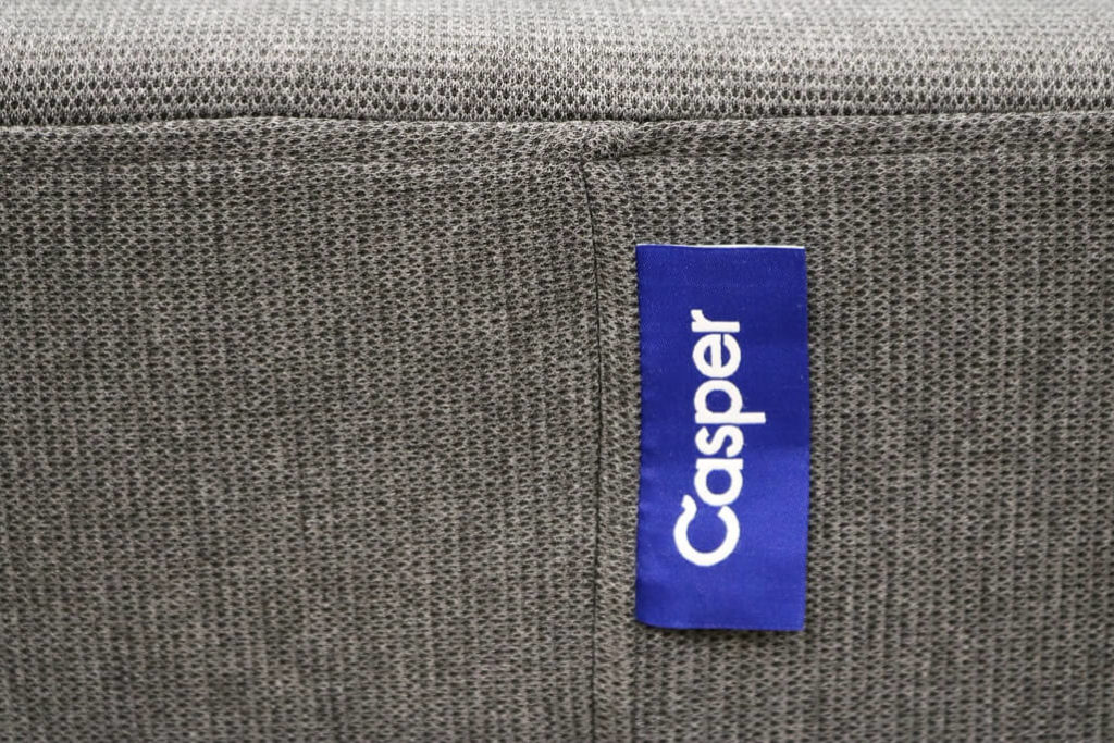 Image of the Casper Essential mattress company logo stitched on the side wall of the mattress.