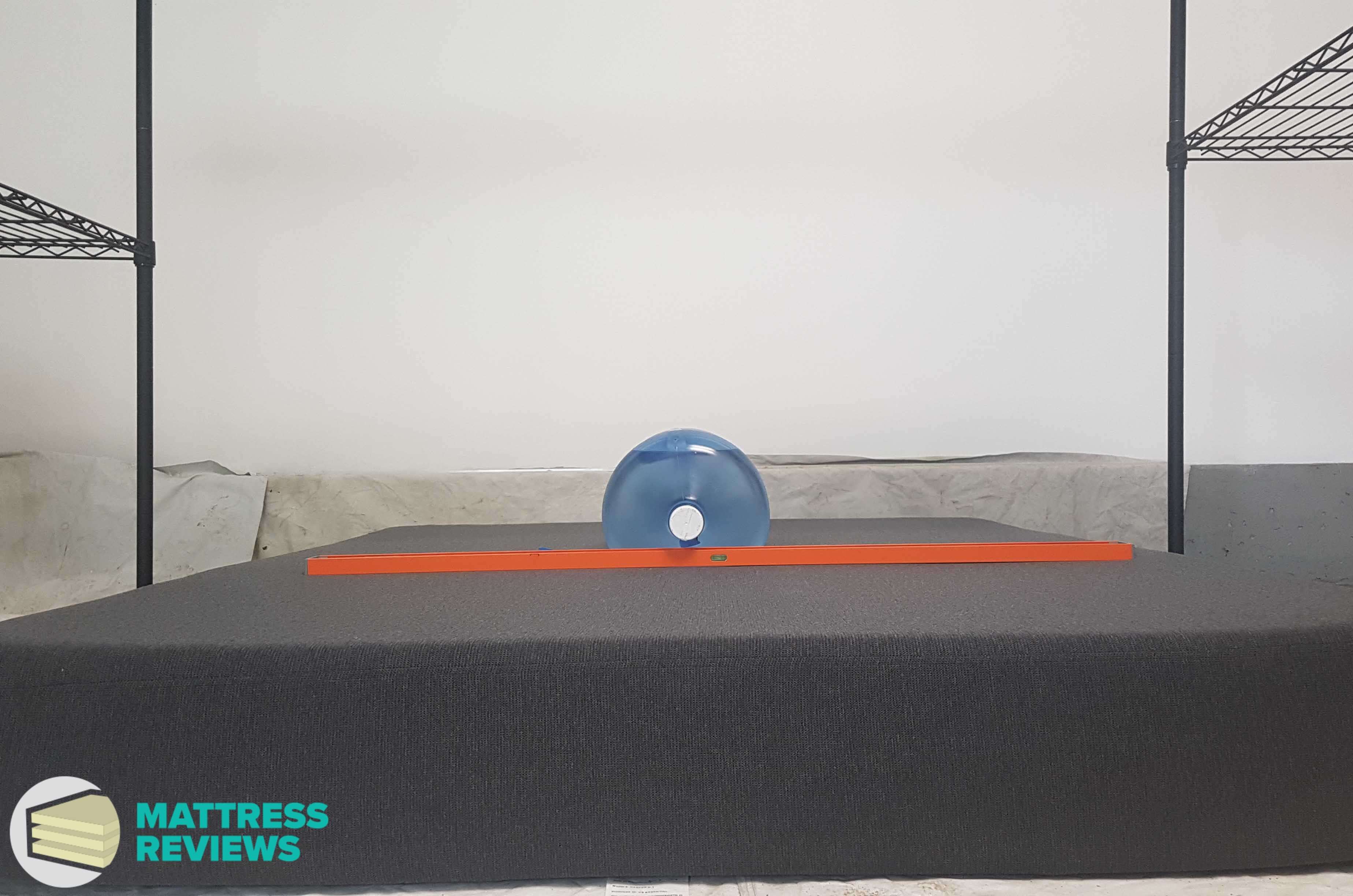 Image of the Casper Essential mattress firmness test.
