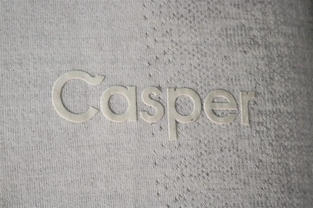 Image of the Casper Wave mattress company logo stitched on the side wall of the mattress.