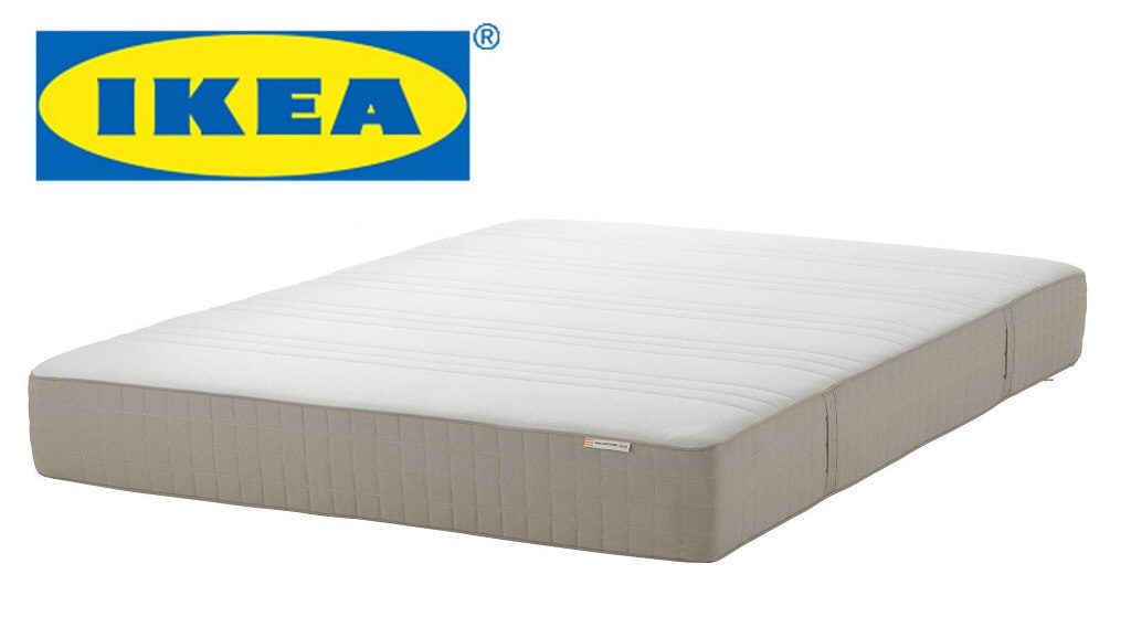 Image of the IKEA company logo over top of a three-quarter view of the IKEA spring mattress.