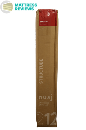 Image of the brown and red Structube mattress box standing upright after delivery.