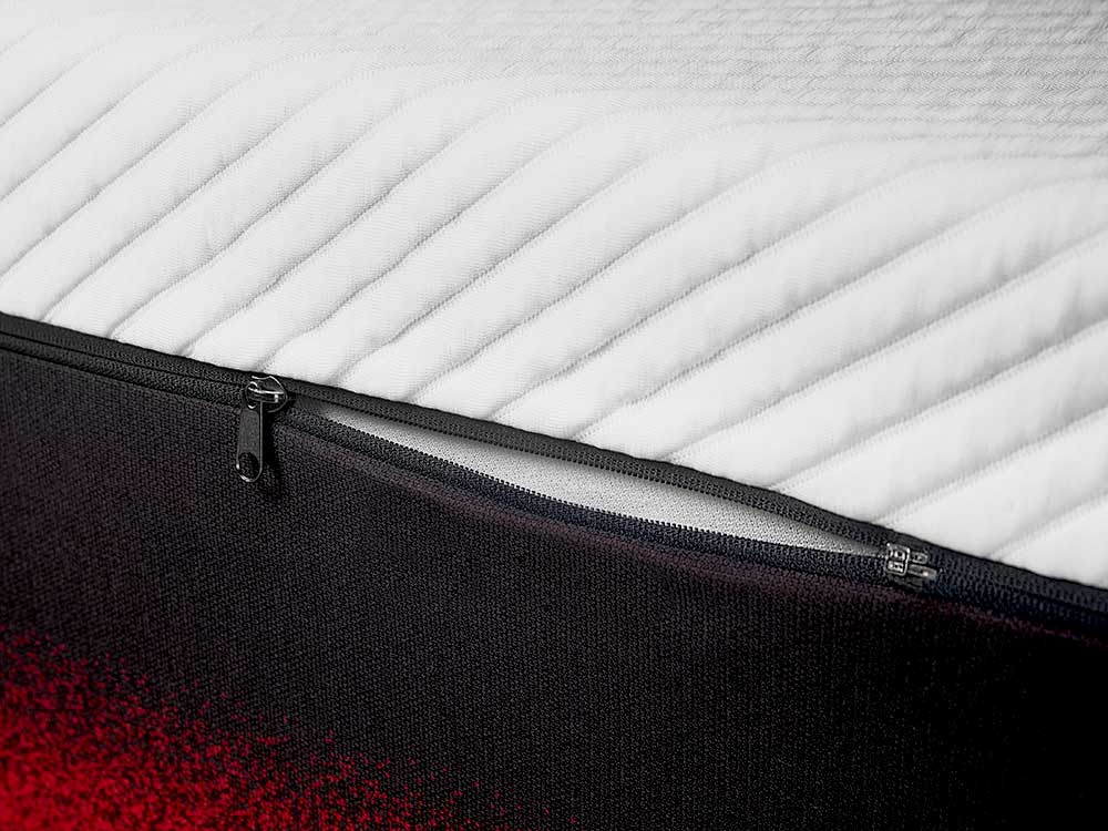 Close-up view of Apollo mattress top cover slightly unzipped