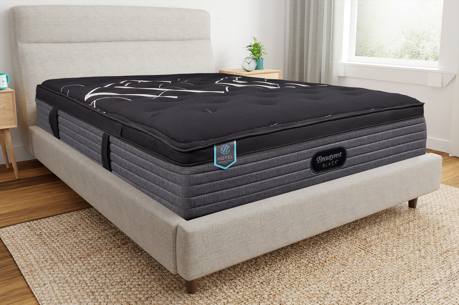 BeautyrestBlackPresidentialSuiteCornerAngle MattressReviewscom Corner view of the Beautyrest Black Hotel Presidential Suite mattress on a bedframe in a bedroom