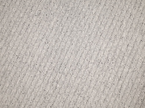 Closeup view of the grey Casper Original mattress cover fabric
