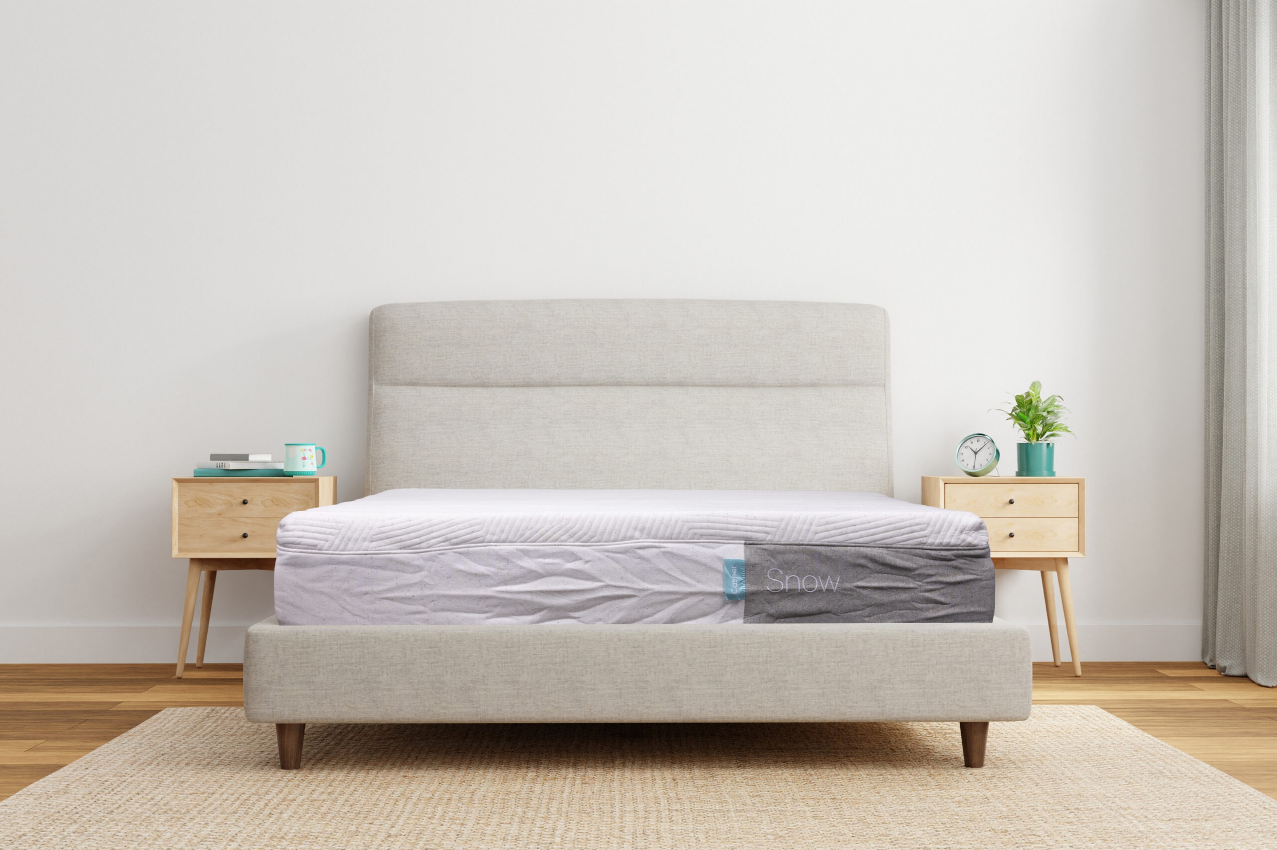 Front angle photo of a Casper Snow mattress on a bed