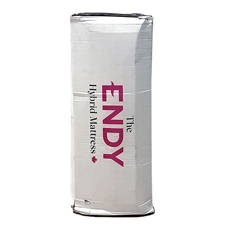 The white box of the Endy Hybrid Mattress with company logo