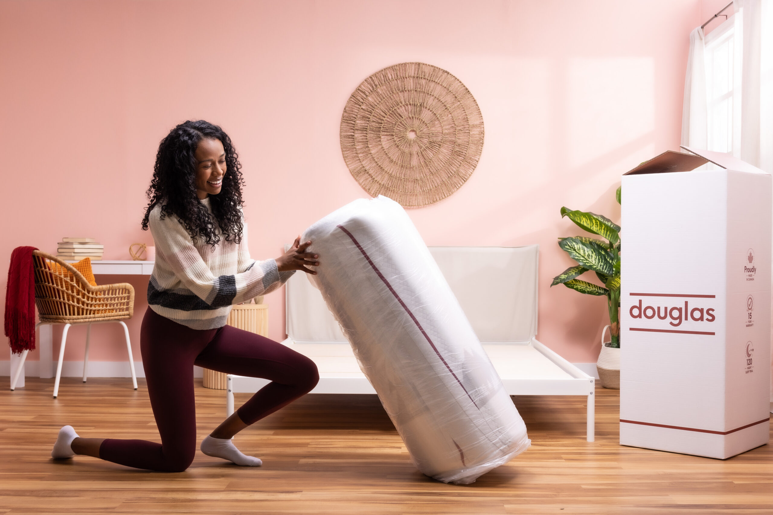 Photo of a person setting up their Douglas mattress.