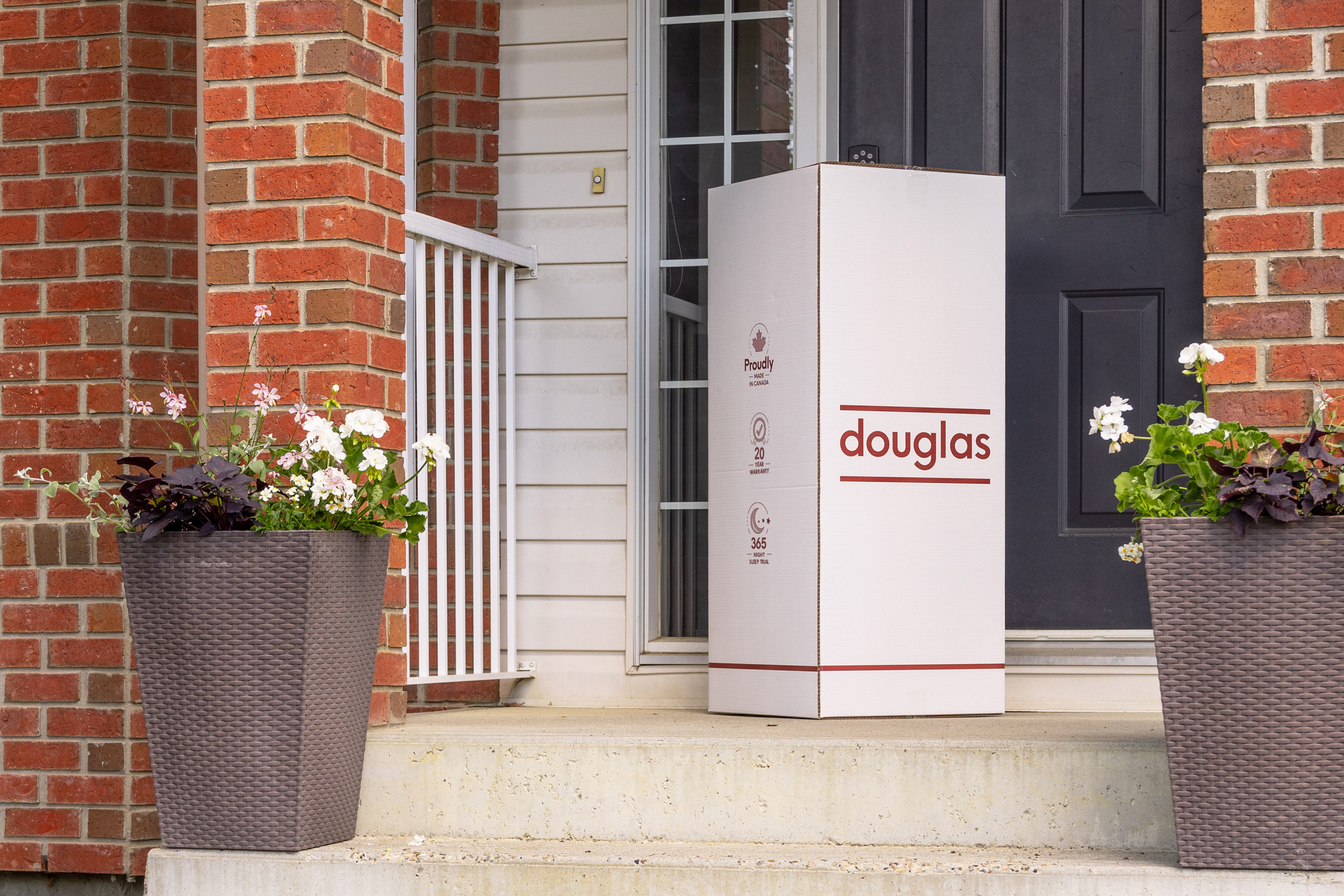 Image of a douglas mattress box being delivered on a front doorstep