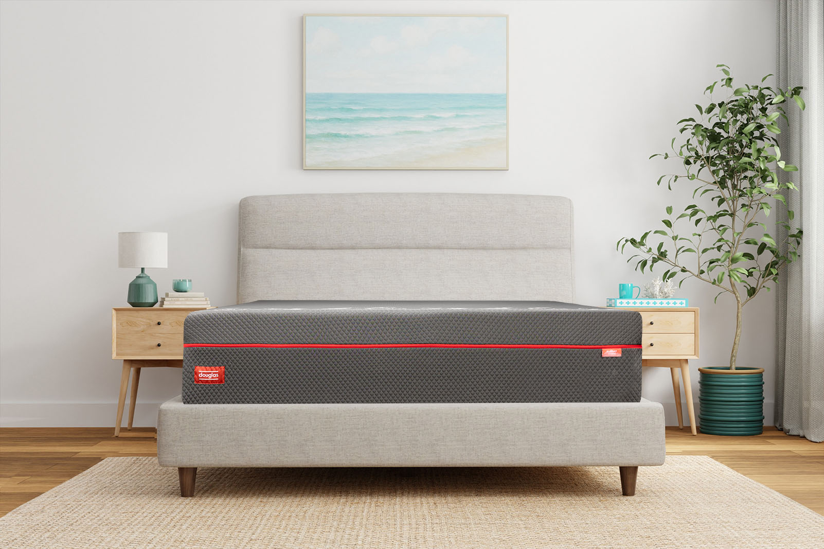 Front angle photo of a Douglas Summit Hybrid mattress on a bed