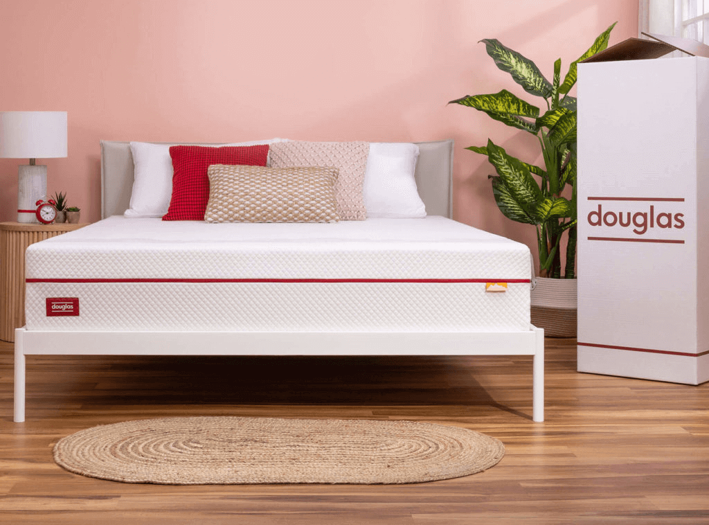 The Douglas Alpine mattress and box in a beautiful bedroom with pink walls