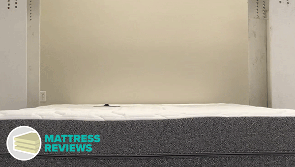 Image of the GhostBed Luxe mattress motion isolation test.