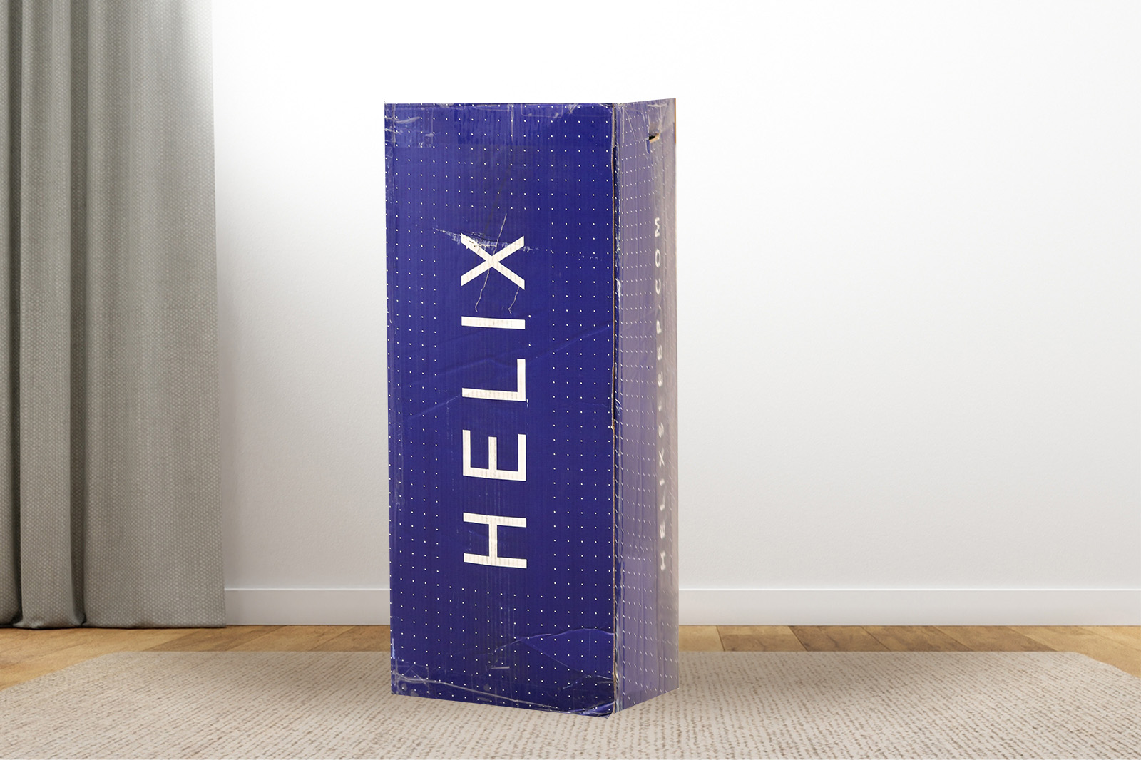 HelixBox MattressReviewscom Photo of the Helix mattress box on a bedroom floor