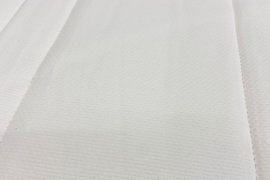 Close up image of the IKEA Matrand mattress cover.