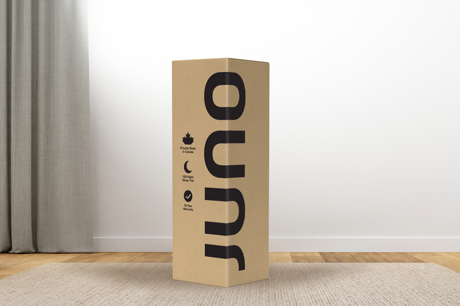 JunoHybridBox MattressReviewscom Photo of a Juno mattress delivery box sitting on a carpet in a room