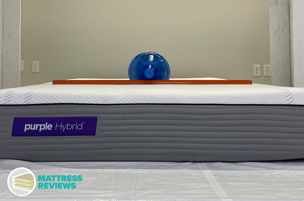 Water jug and level used in Purple Hybrid mattress engineer firmness test
