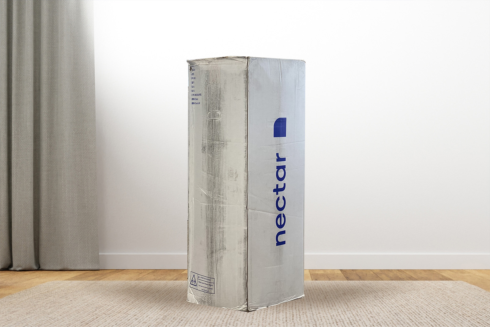 NectarPremierBox MattressReviewscom Photo of the Nectar Premier mattress box on the floor in a bedroom taken from a front angle