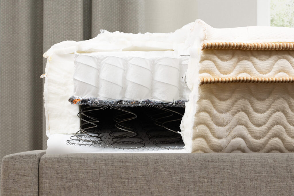 SaatvaClassicInternalsSide MattressReviewscom Side view of the Saatva Classic mattress's internal layers