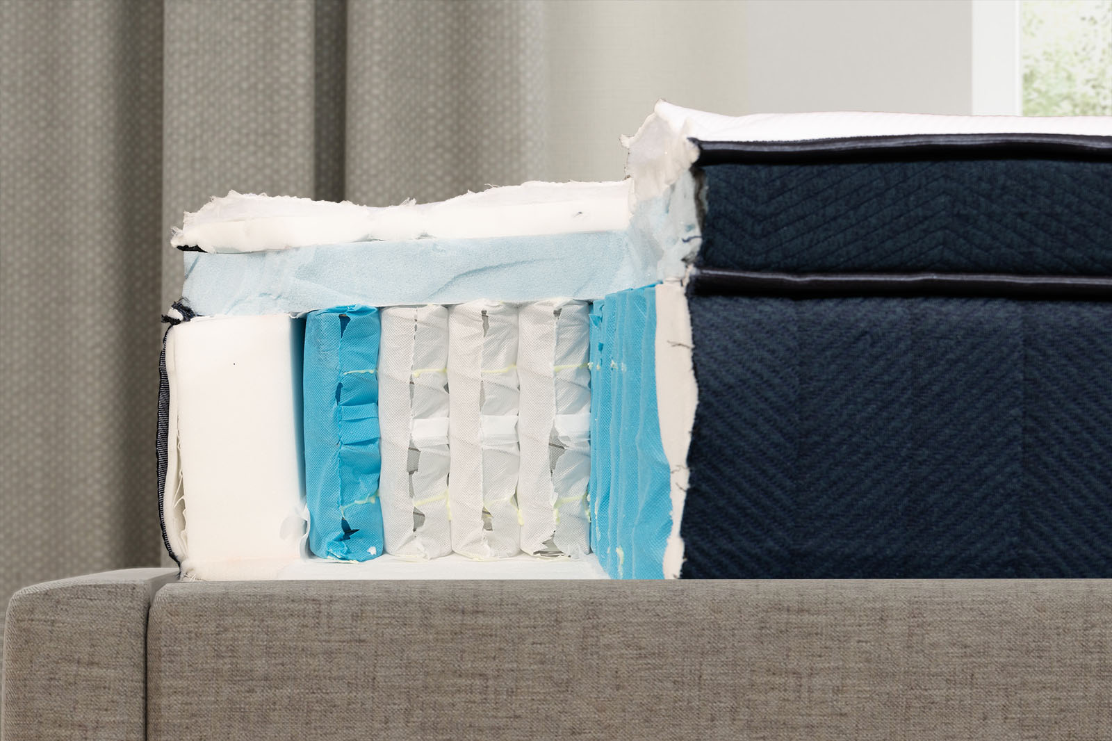 close up side view of the internal layers of the silk snow hybrid mattress