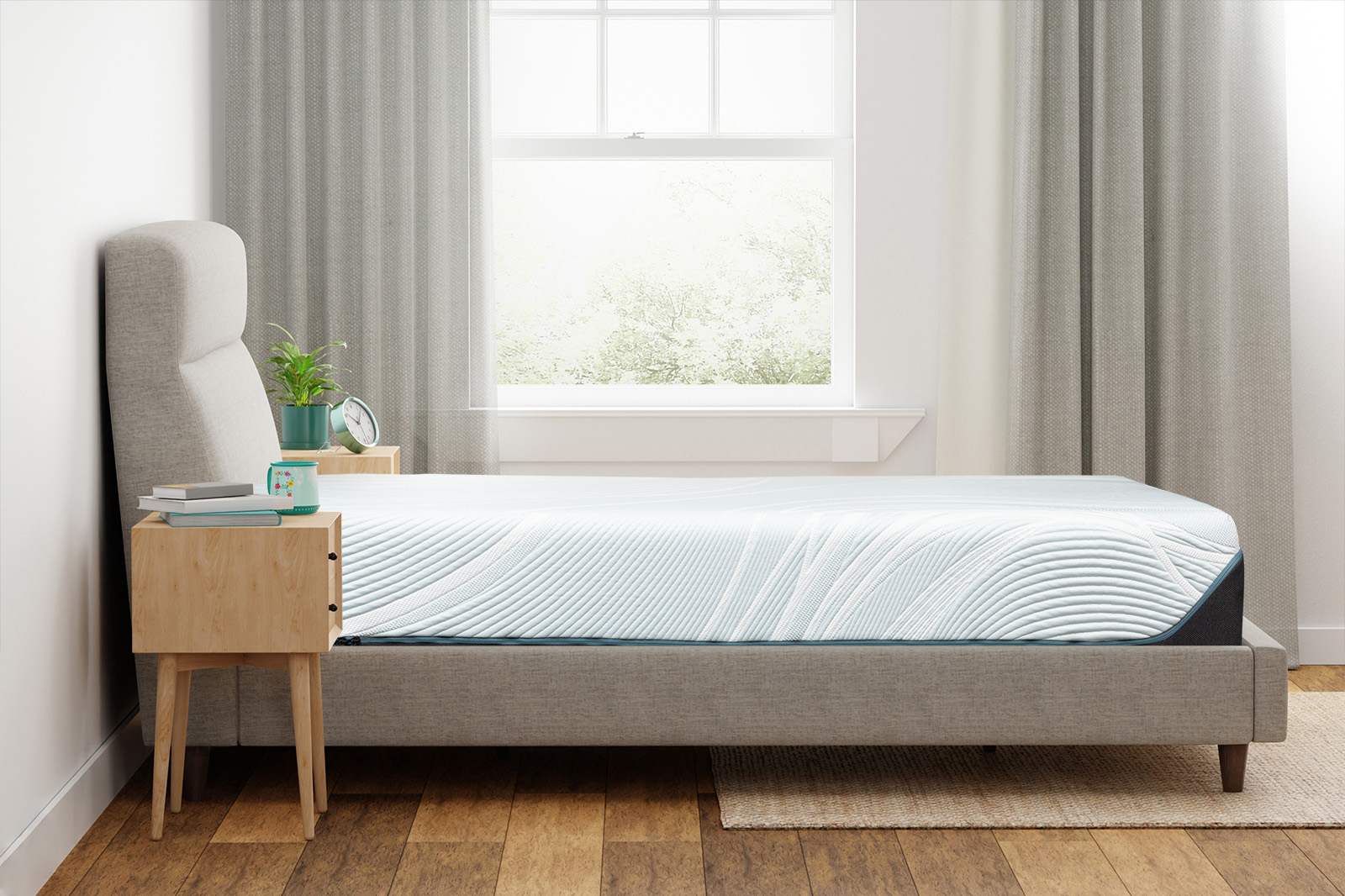 Tempurpedic mattress laying flat on a bedframe